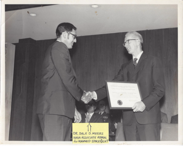 NASA Administrator James Fletcher presenting Jim an award for perfecting a new troubleshooting tool known as Time Domain Reflectometry (TDR) at an awards ceremony at Huntsville, Alabama after Apollo 16 mission.